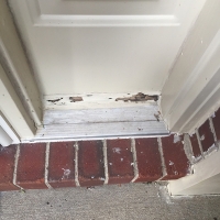 Termite-damage-to-trim-board-at-front-door